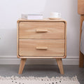 Wooden bedside table with drawers.