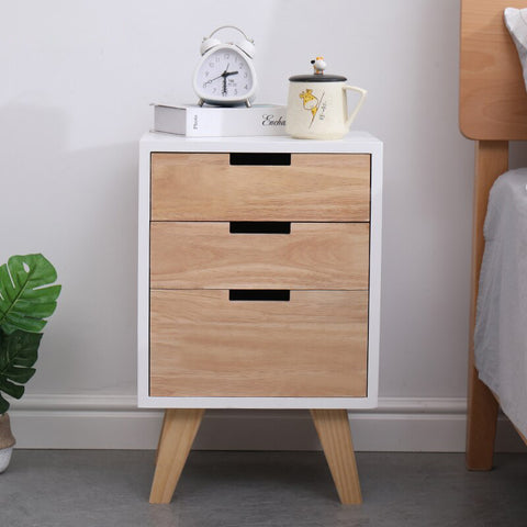 Wooden bedside table with drawers.