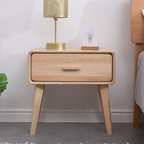 Wooden bedside table with drawer.