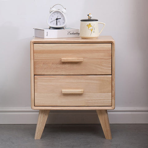 Wooden bedside table with drawers.