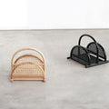 magazine rack in black and natural on floor