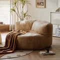 Beige lounge chair with throw