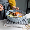 Round ceramic bowl with food.