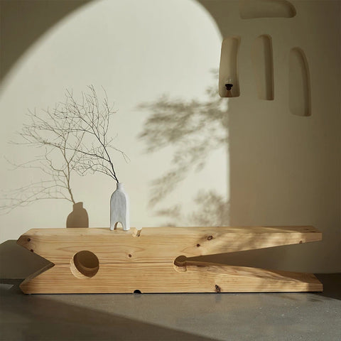 Peg-shaped side table with accessories