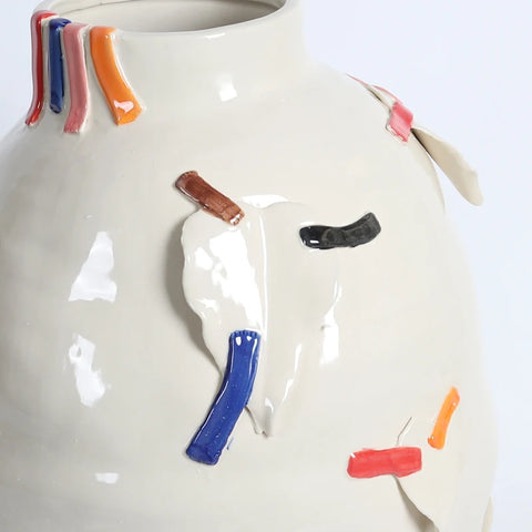 Close up of ceramic vase with colourful detail