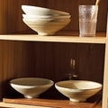 Stacked bowls on shelf