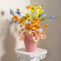 Strawberry vase with flowers