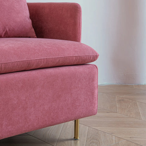 Close up of corner of pink armchair