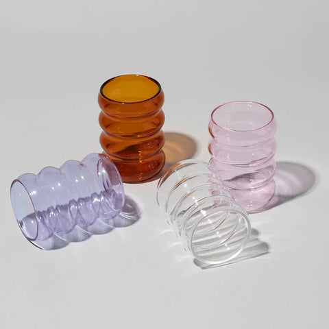 4 bubble glasses on table 