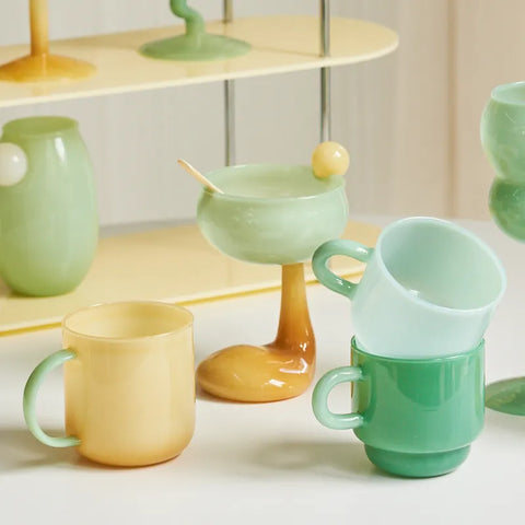 Pastel bowl glasses amongst other mugs