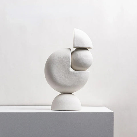 White sculpture on table