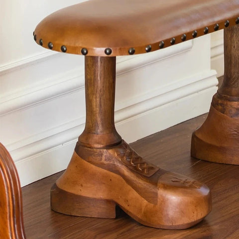 Close up of shoe-shaped bench leg