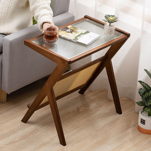 Wood, glass and rattan coffee table with magazine rack.