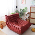 Leather-look slouch couch chair.