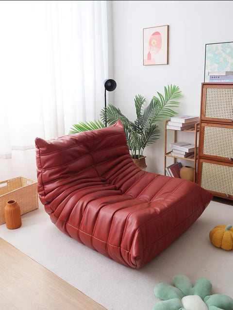 Leather-look slouch couch chair.