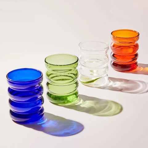 4 bubble glasses on table 