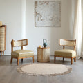 Matching set of wood and rattan, padded chairs and round table.