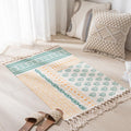 Geometric woven rug with tassels