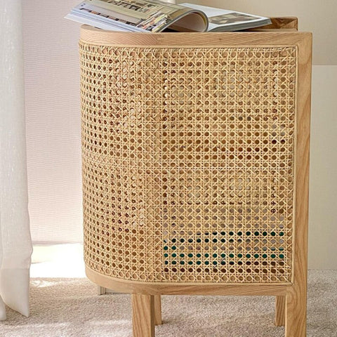 Side view of wood and rattan side table.