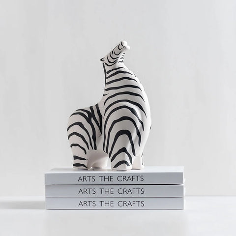 zebra ornament sat on stack of books