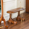 Bench with shoe-shaped feet in hallway