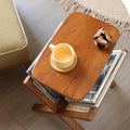 Wood and rattan side table with magazine rack.