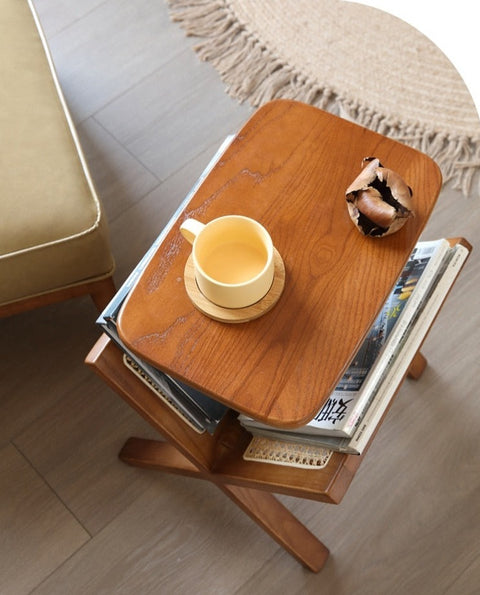 Wood and rattan side table with magazine rack.