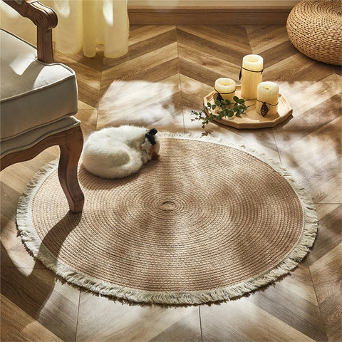 Woven round rugs with tassels.