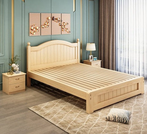 Wooden bed frame in bedroom.