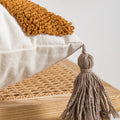 Close up of tassel on cushion