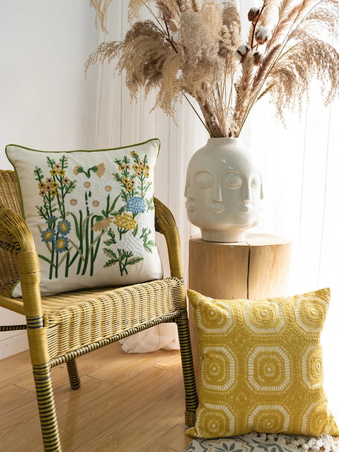 Embroidered pillows on chair