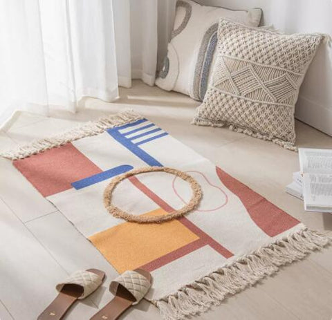 Geometric woven rug with tassels