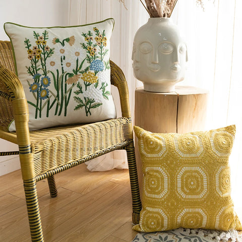 Embroidered pillows on chair