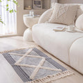 Geometric woven rug with tassels