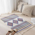 Geometric woven rug with tassels