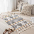 Geometric woven rug with tassels