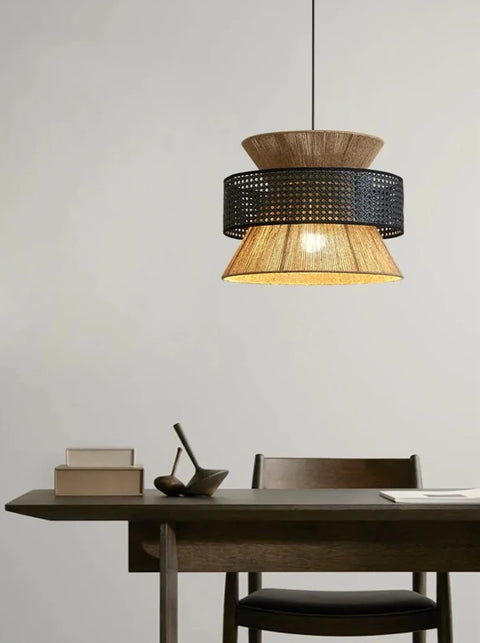 Black rattan atlas lamps hanging above table