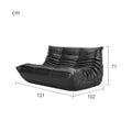 Leather-look slouch couch chair with dimensions.