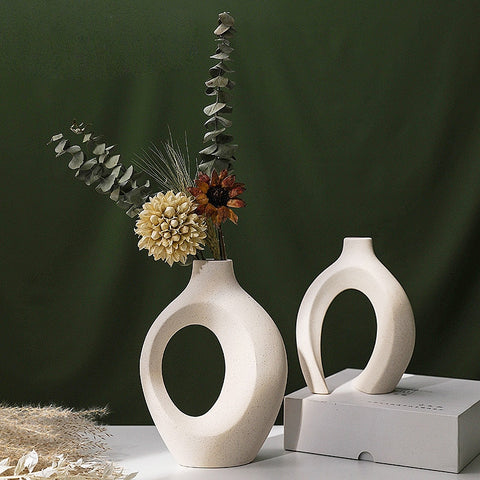  Two vases with dried flowers