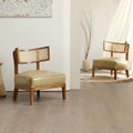 Matching set of wood and rattan, padded chairs.