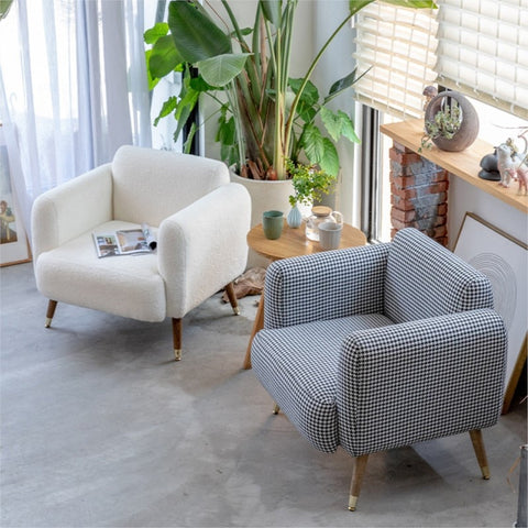 Two padded chairs in living room.