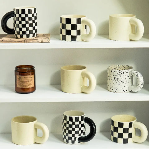 Assortment of mugs on shelves