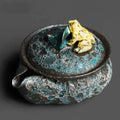 Textured teapot with frog