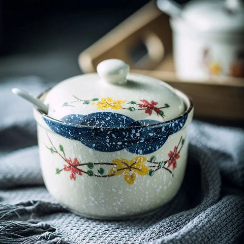 Close up of ceramic dish with lid and spoon