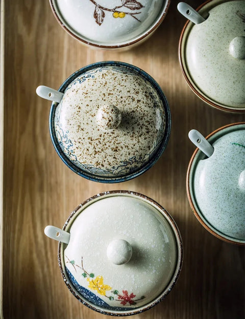 Sugar/spice dishes on table from above