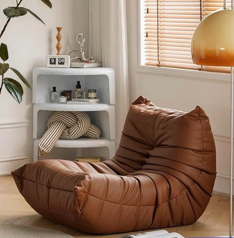 Leather-look slouch couch chair.