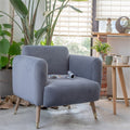 Padded chair in living room with magazine.