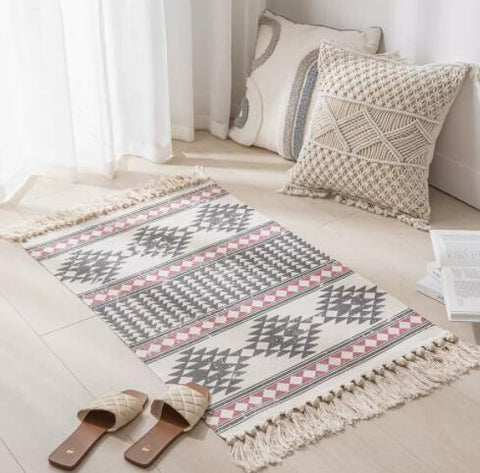 Geometric woven rug with tassels