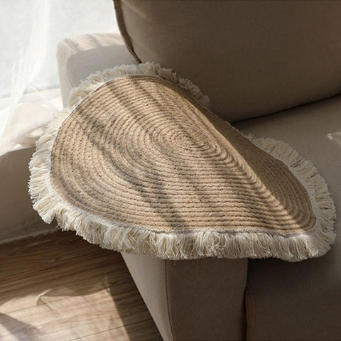 Woven round rugs with tassels.