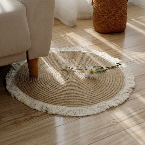 Woven round rugs with tassels.